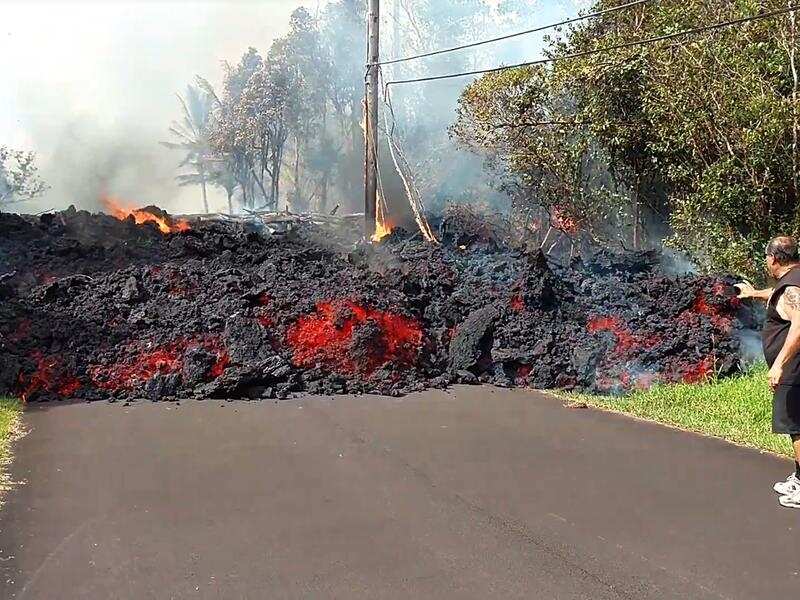 Lava flows down residential road in Hawaii