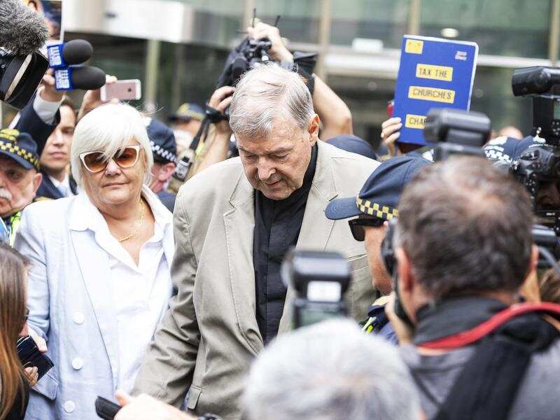 Cardinal George Pell (Centre) is seen in Melbourne, Australia,
