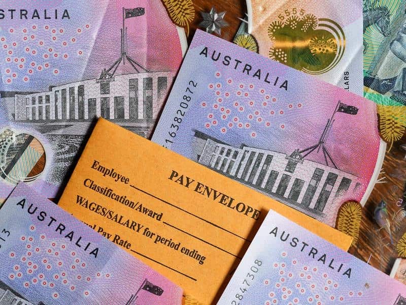 Australian currency and a wages envelope.