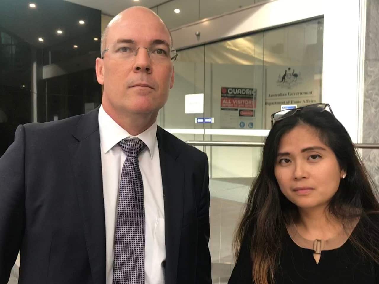 Bernadette Romulo (right) with her lawyer, Angus Francis.