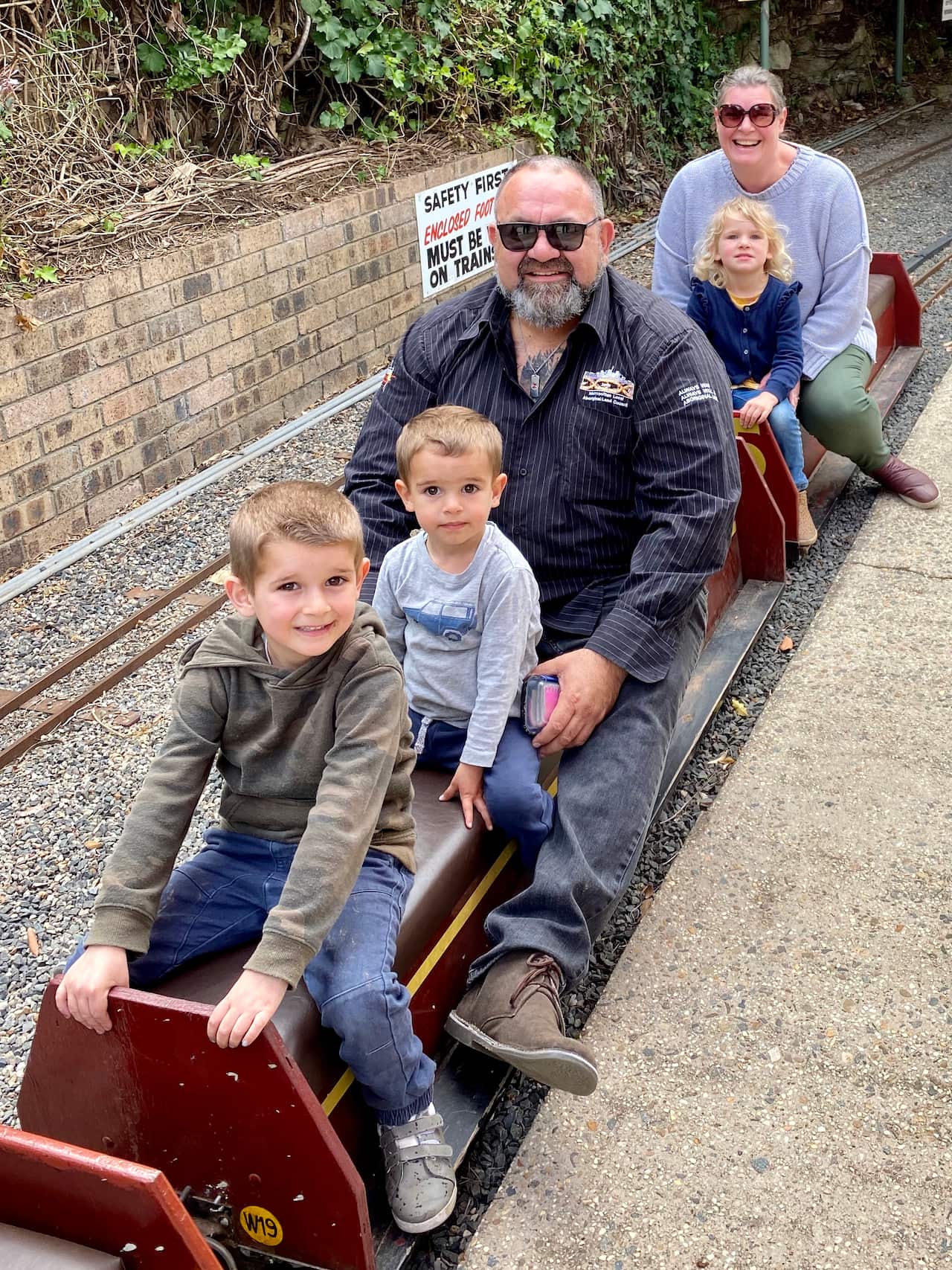 Brendan with three of his eight children,  Tre Marrawarra (6) , Zamzi Mae (5), Cash Paaka (3).