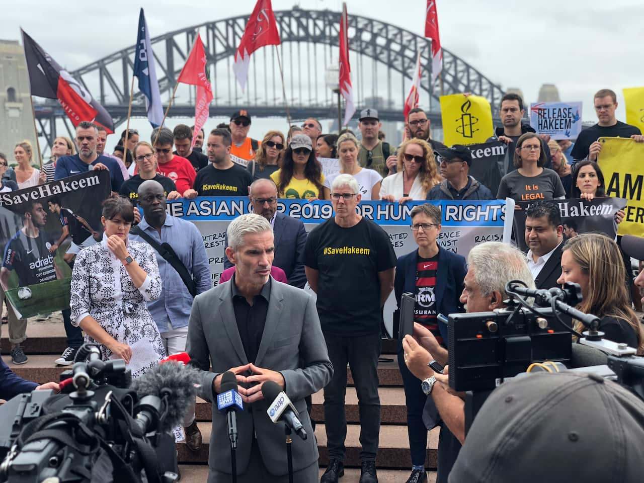Former Socceroos captain Craig Foster speaks at the Sydney protest.
