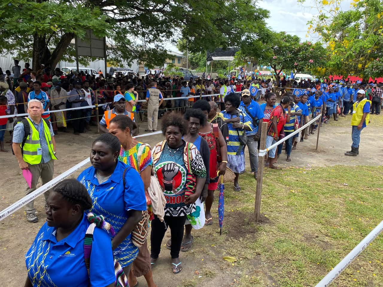 People line up at a polling station to vote. 
