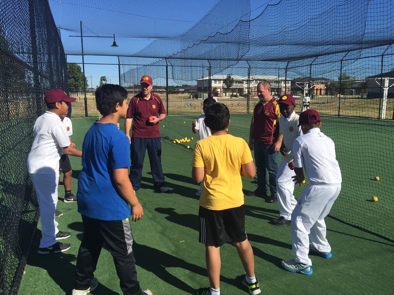 Coach Matthew Shawcross and president Paul Stockwell doing drills with the kids