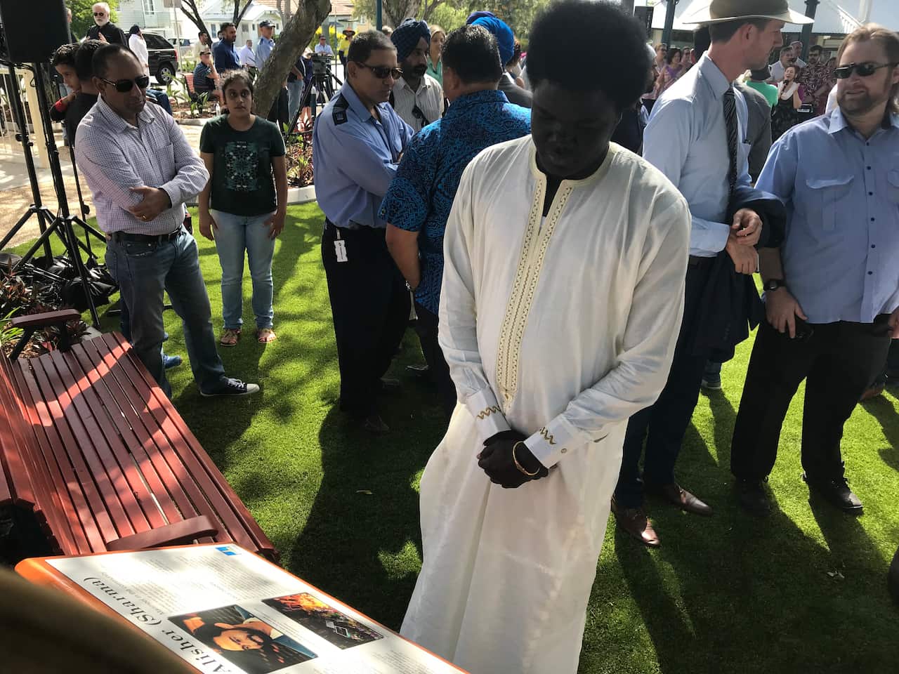 Family and friends of Manmeet Alisher have gathered in Brisbane on the anniversary of his death.