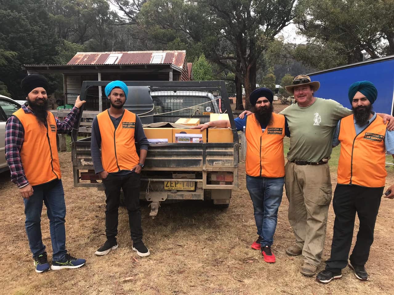 Sikh volunteers visit farms with food donations after bushfires burned out of control in Braidwood.