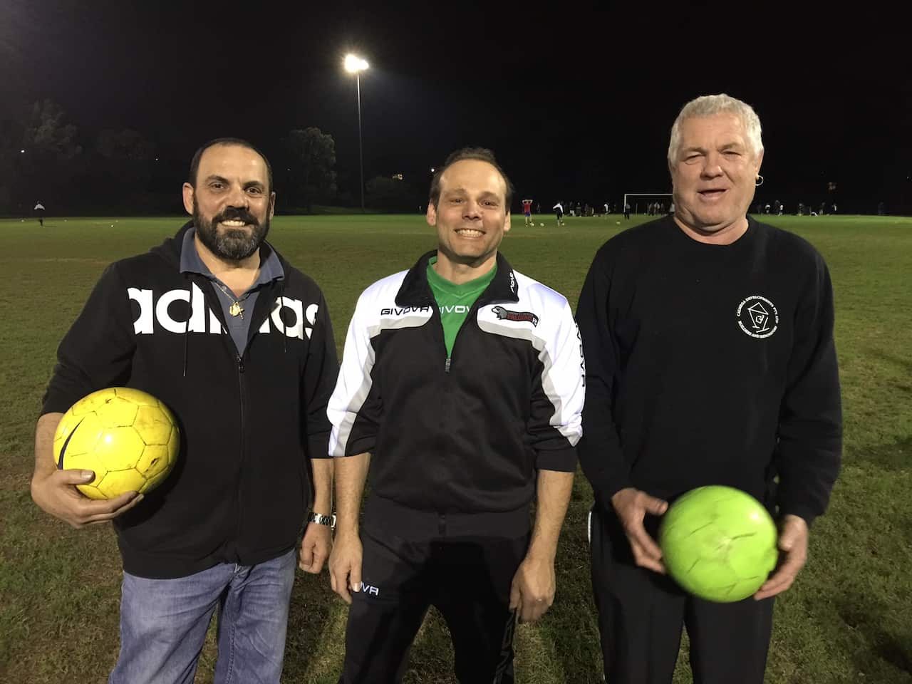 Coach Anthony Risoli (centre) with parents