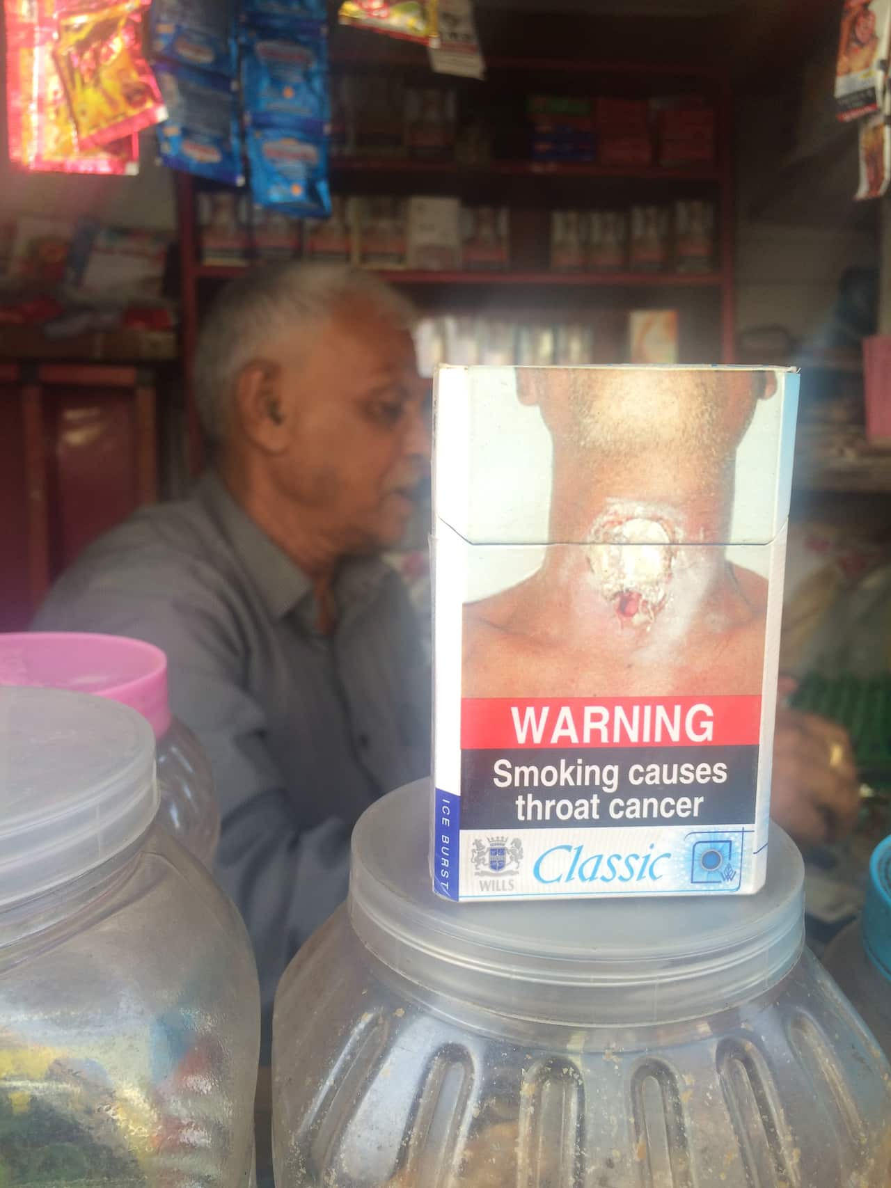 A cigarette packet with the new health warnings that cover 85% of the packet.