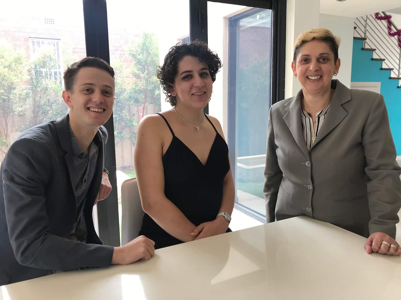 Amy with her brother Dominic and mother Tara.