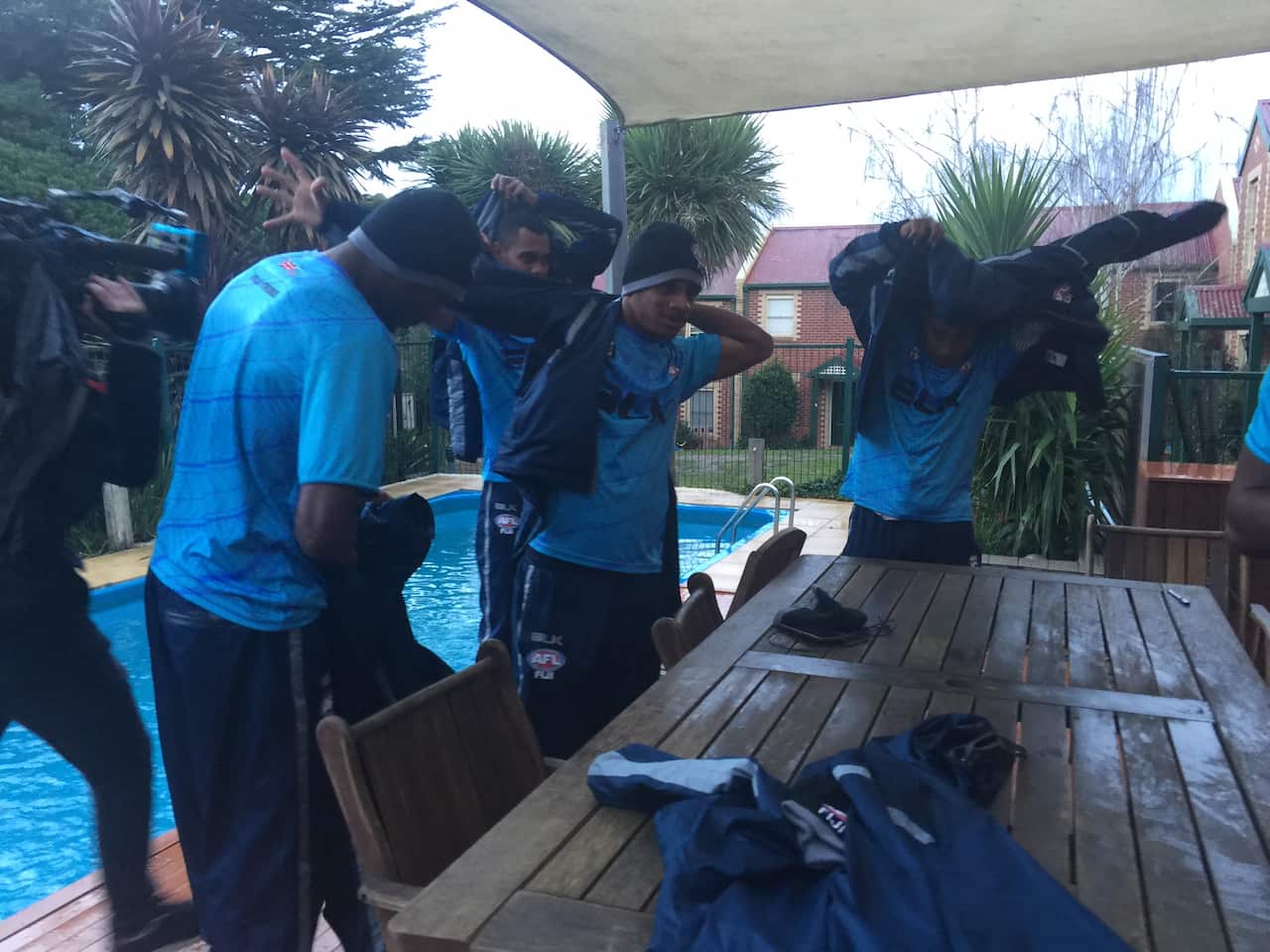 The Tribe rugging up for the cold Melbourne day