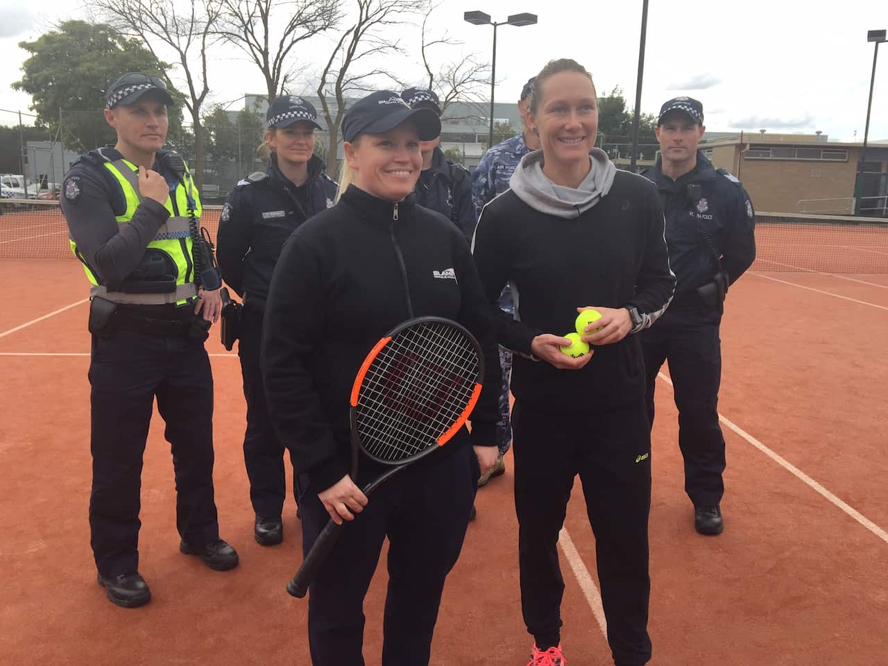 Stosur oays a visit to a community tennis club