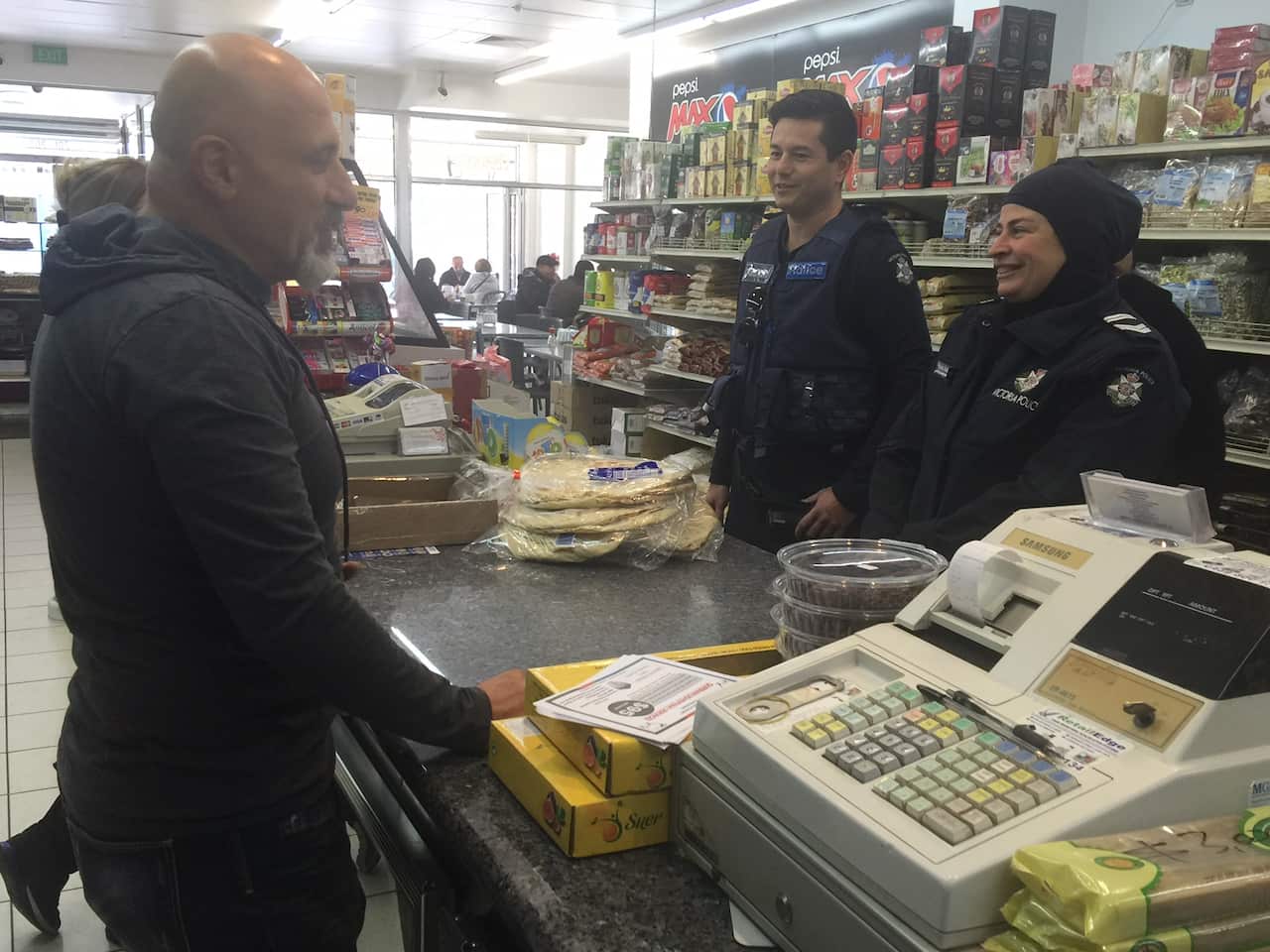 Leading Senior Constable Maha Sukkar (right), with partner Leading Senior Constable Jason Waterson meeting members of public
