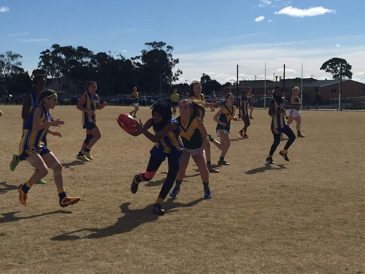 Amren Abrahim receives a pass in Flemington grand final