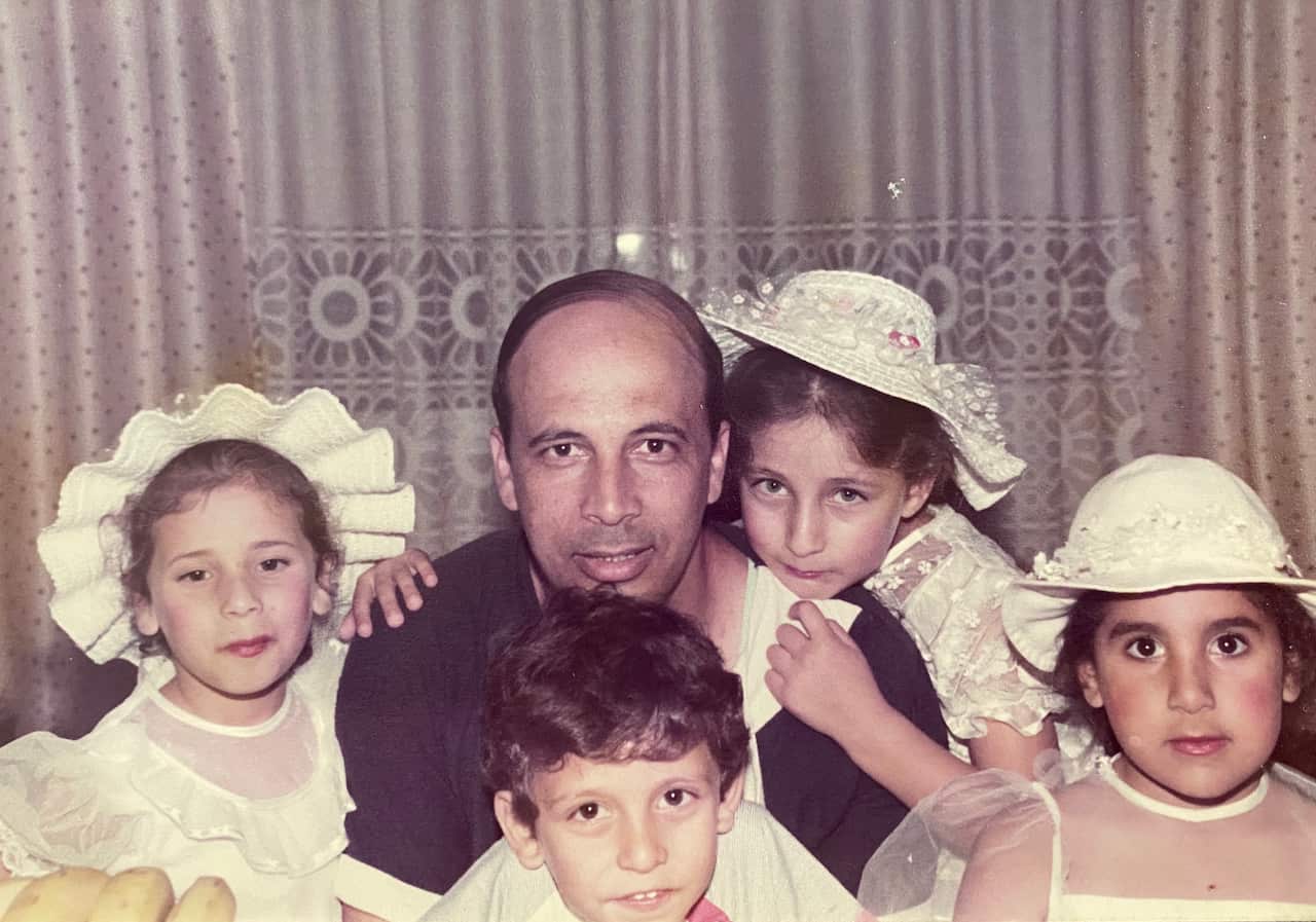 Ghania and her family in their Tripoli apartment before it was bombed.