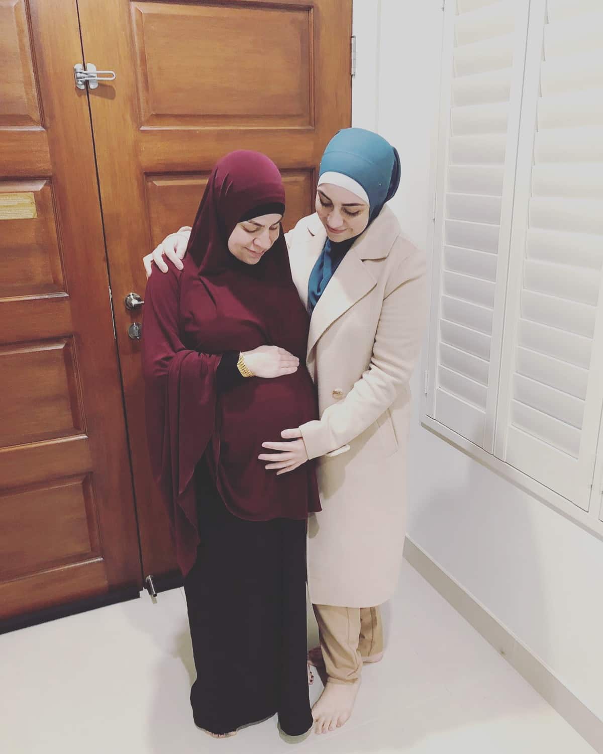 Maryam holding Sarah's pregnant belly. The sisters had children six weeks apart which eventually lead to inspiring Halal Bubs.