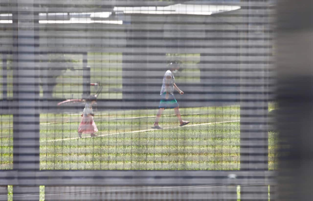 A woman and child seen inside the Christmas Island detention centre