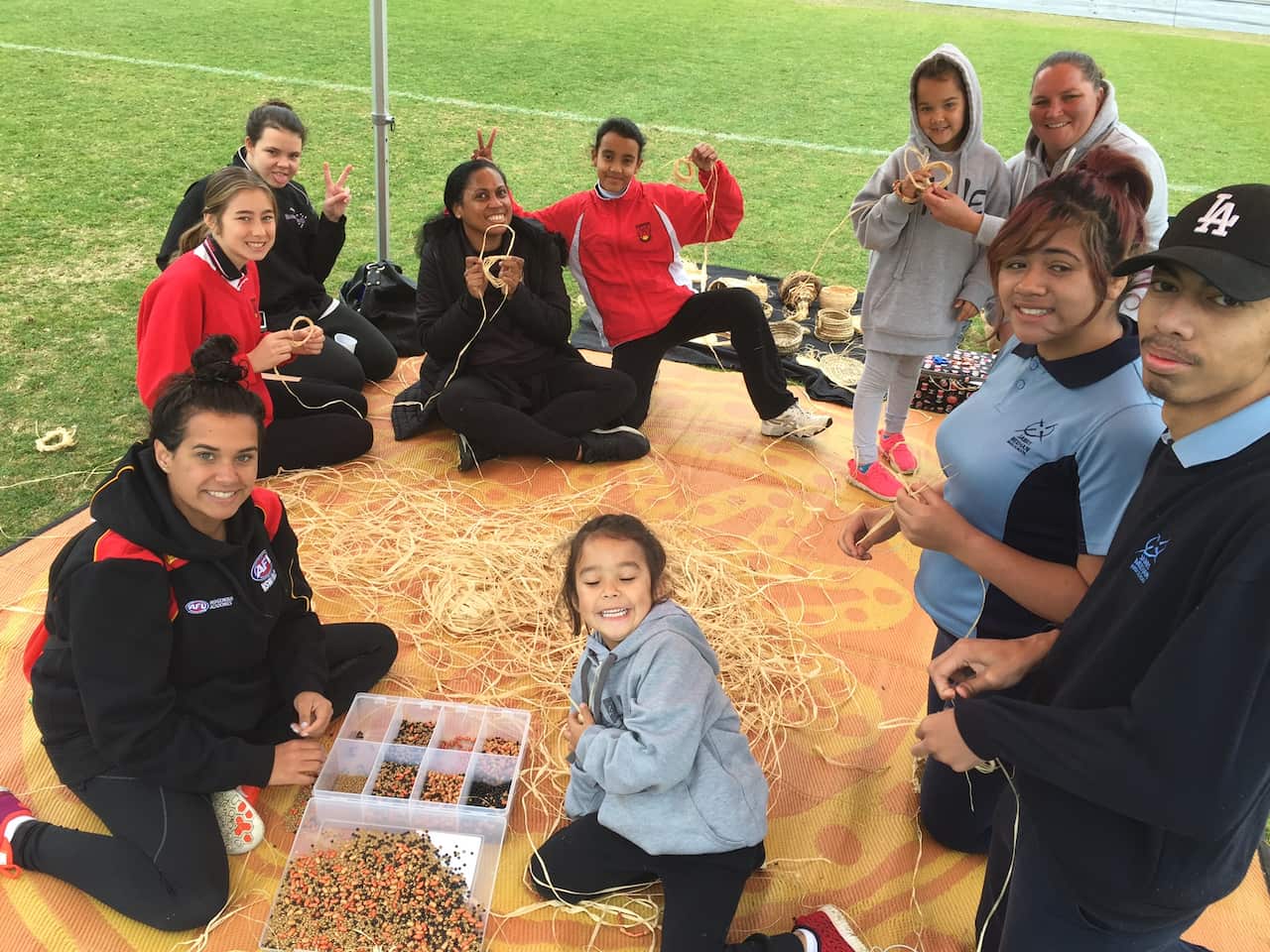School children learn the art of weaving