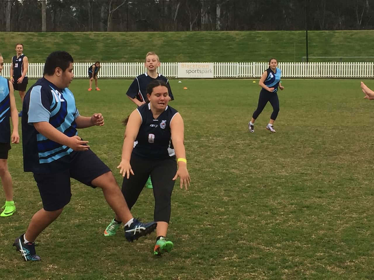 Western Sydney school kids learn how to play AFL