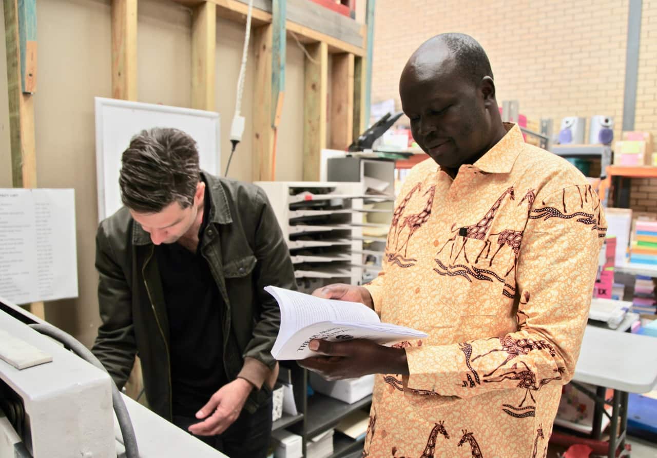 Peter collects his latest book from the printer. 