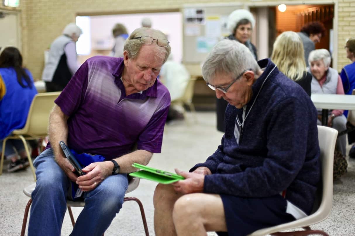 Seniors teach each other digital literacy skills at the group. 