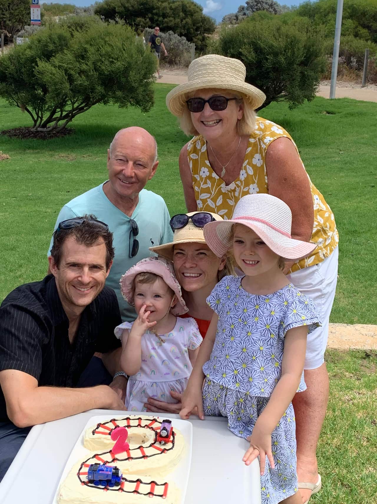 Charlie Trevena (behind the daughters), her husband Richard, her daughters Belle (left) and Rose, and her parents Susan and Michael