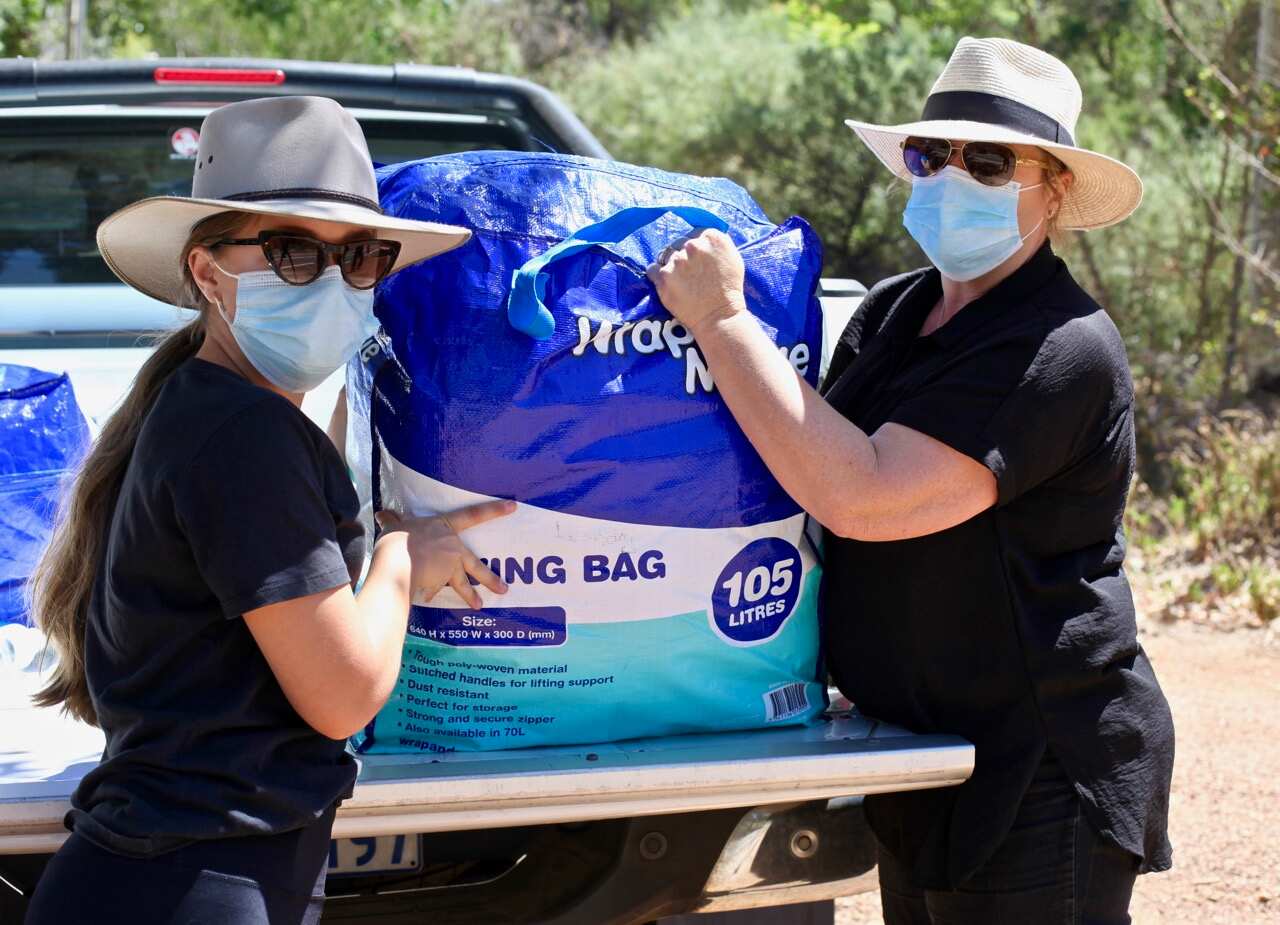 Volunteers from the Country Women’s Association carried emergency donations in on foot on Thursday.    