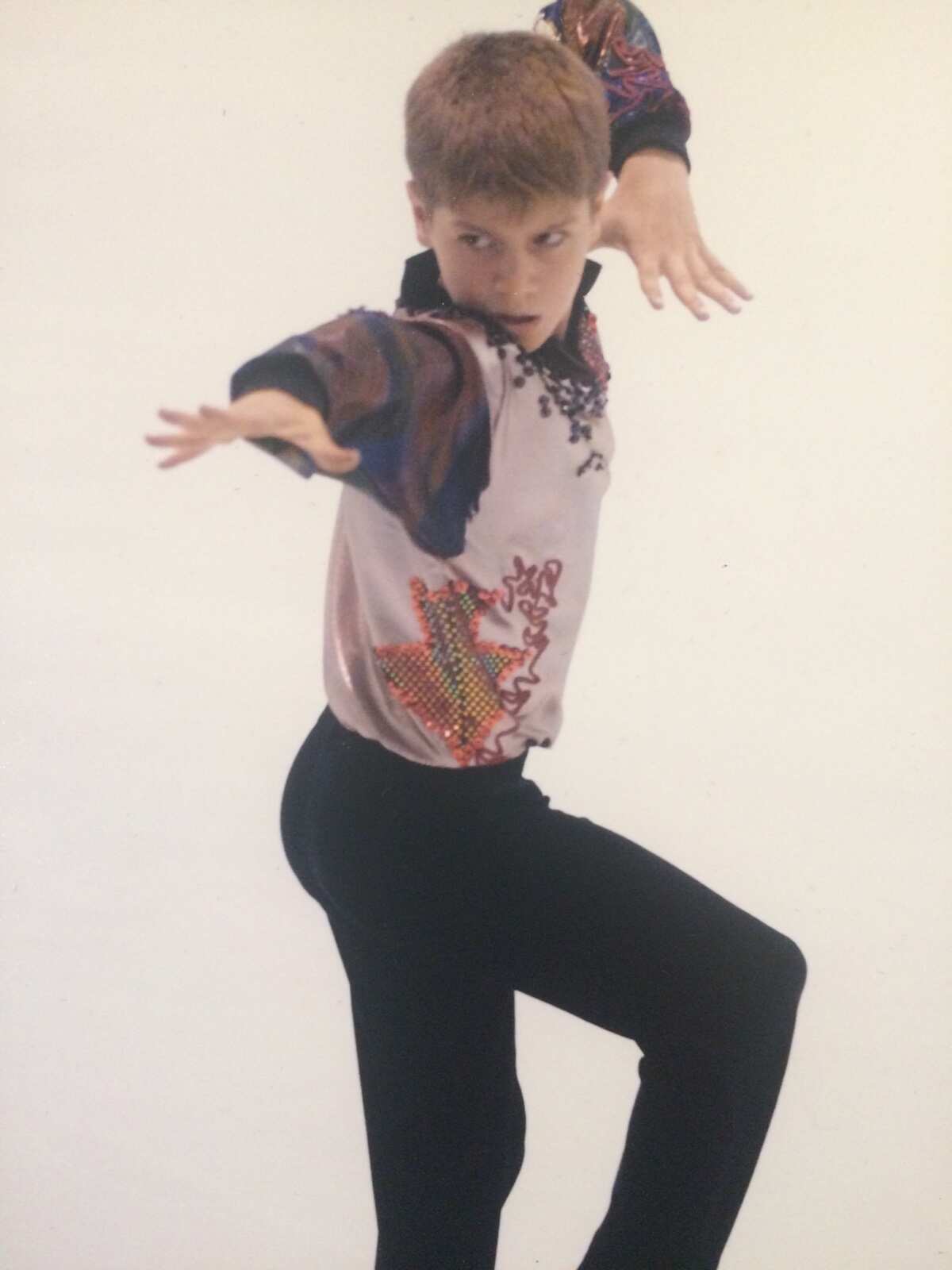 A young Dom ice skating.