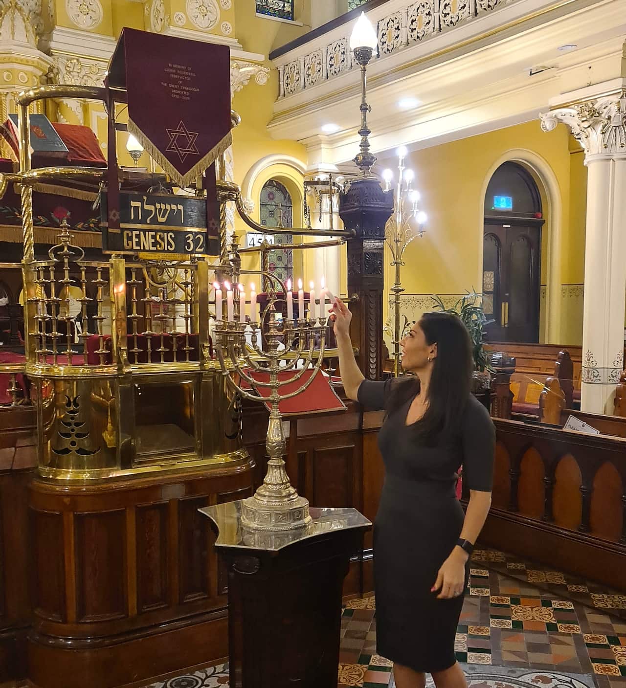 Lauren Ryder lighting the hanukkiah at The Great Synagogue in Sydney