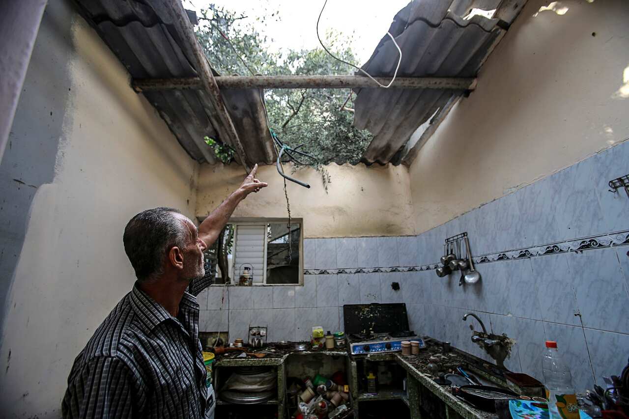 Palestinian man inspects his destroyed house after Israeli air strikes hit the Jabaliya refugee camp. 