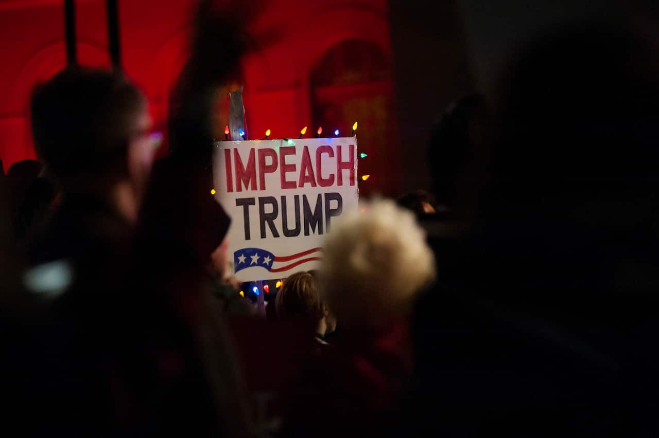 Thousands have rallied across the US on the eve the House of Representatives votes on whether to impeach President Donald Trump.