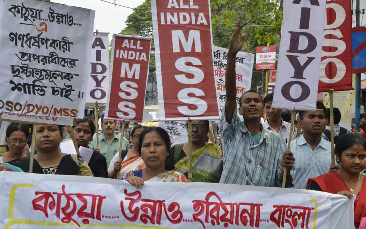 Indian activists shout anti-government slogans as they protest calling for justice following recent rape and murder cases.