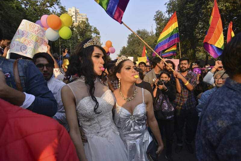 Gay rights activists and supporters walk during the gay pride gathering in New Delhi, India.