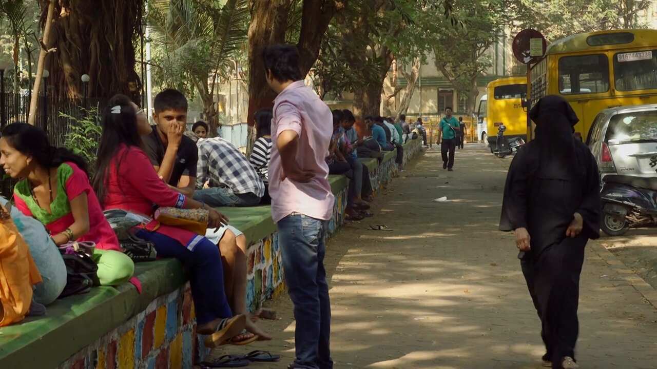 "This is my best disguise," says Rajani. "Because no one knows who is behind the burqa. It makes it easy for me to follow them."