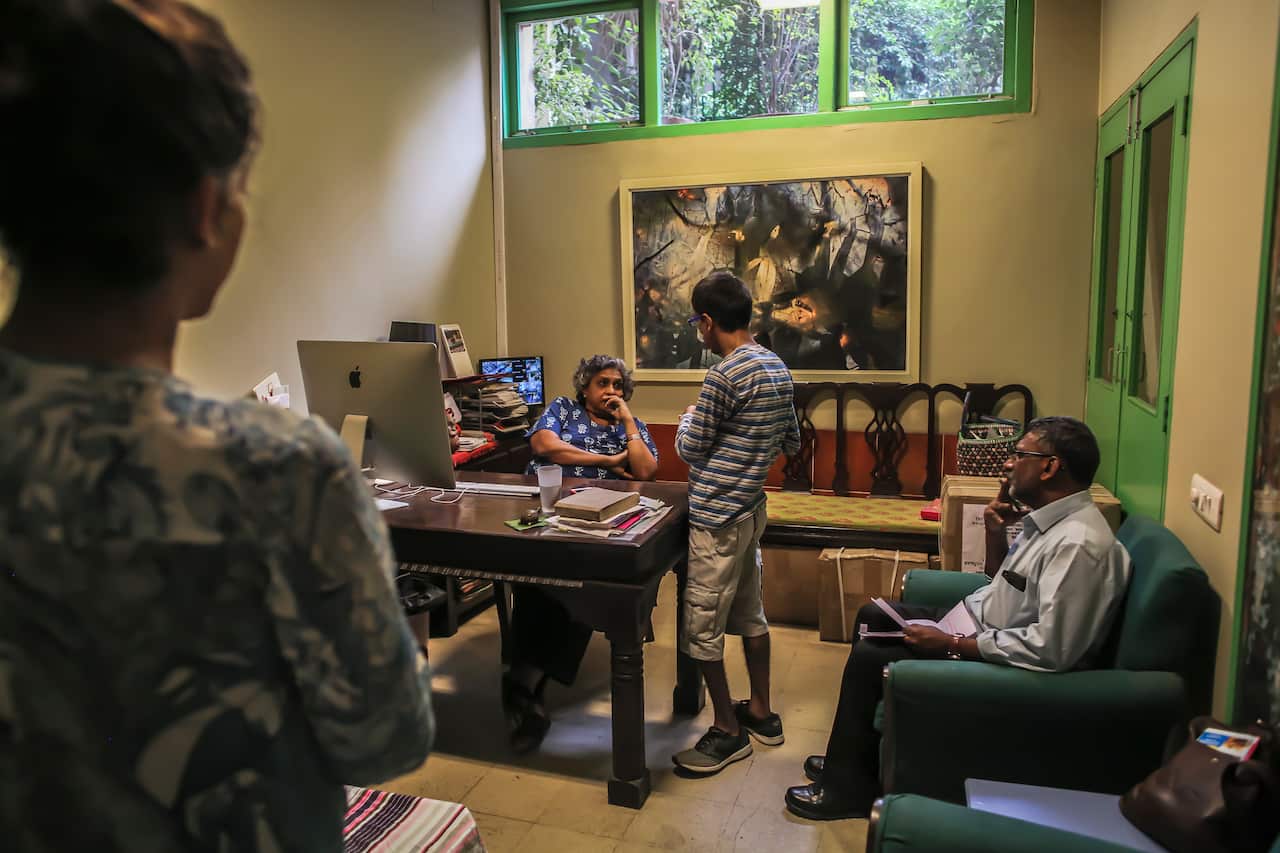 Anjali Gopalan, center, who runs the Naz Foundation, an HIV-patient advocacy group, in her office in New Delhi.
