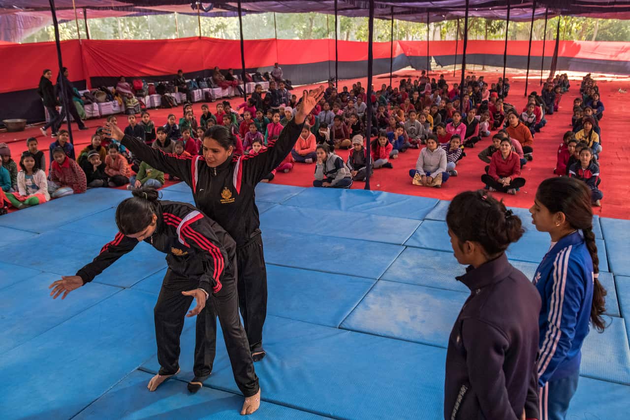 Constables lead a self-defense training camp run by the Delhi Special Police Unit for Women and Children.