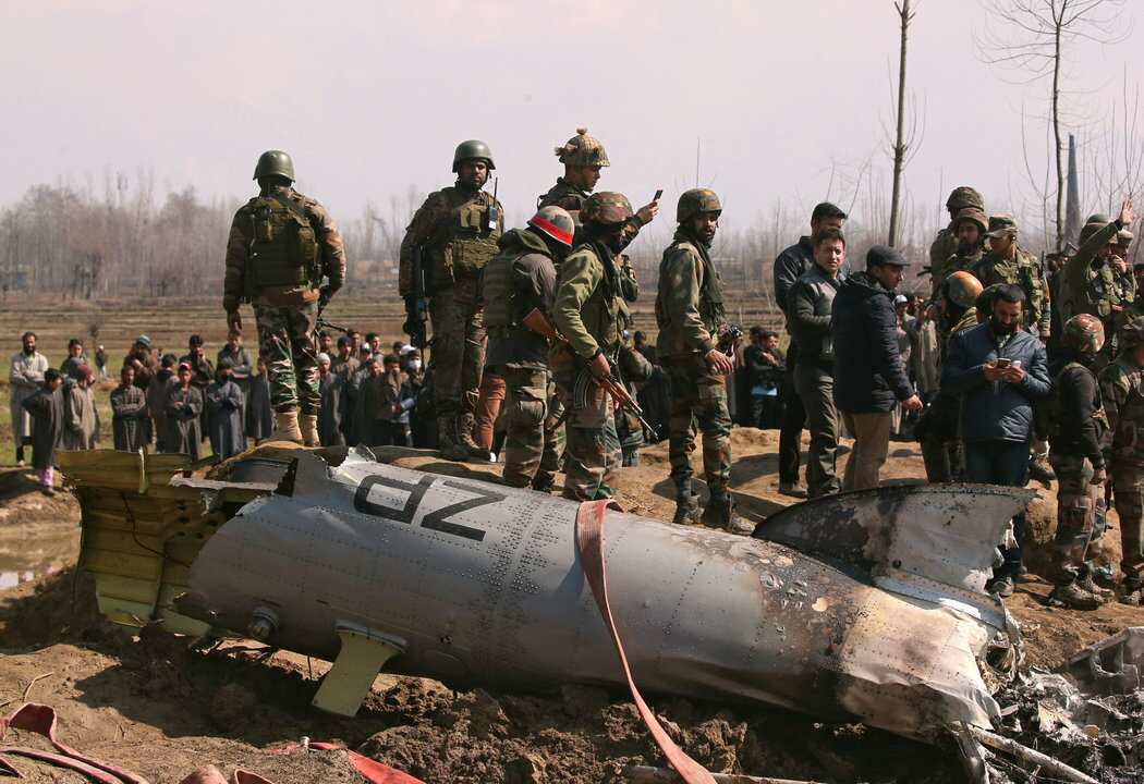 Indian soldiers near the remains of an Indian aircraft after it crashed on Wednesday.