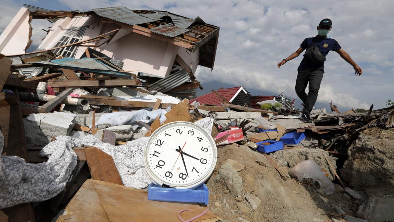 A local resident navigates the ruins of Petobo in Palu, Central Sulawesi, Indonesia.