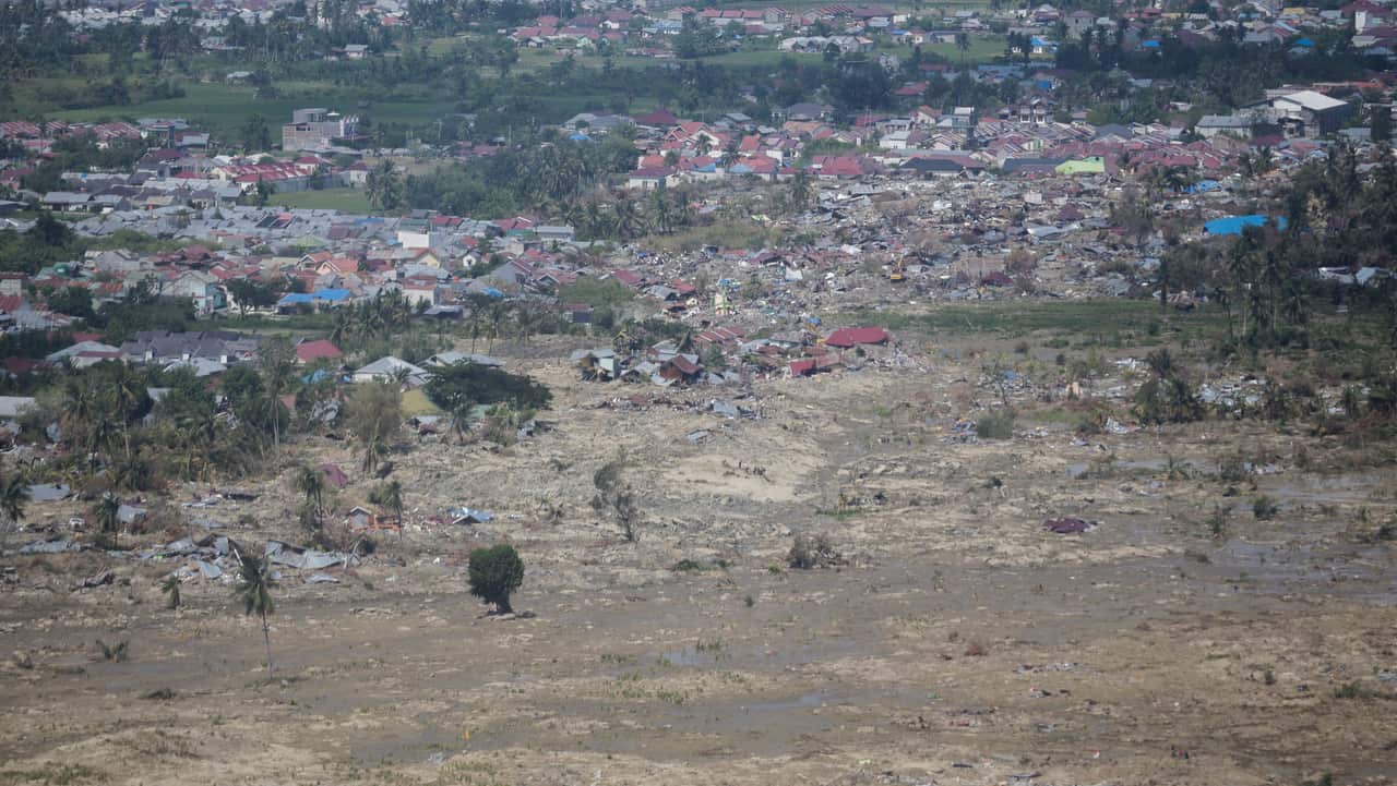 An aerial picture taken from Indonesian Red Cross helicopter shows a disaster devastated area in Petobo, Palu, Central Sulawesi.