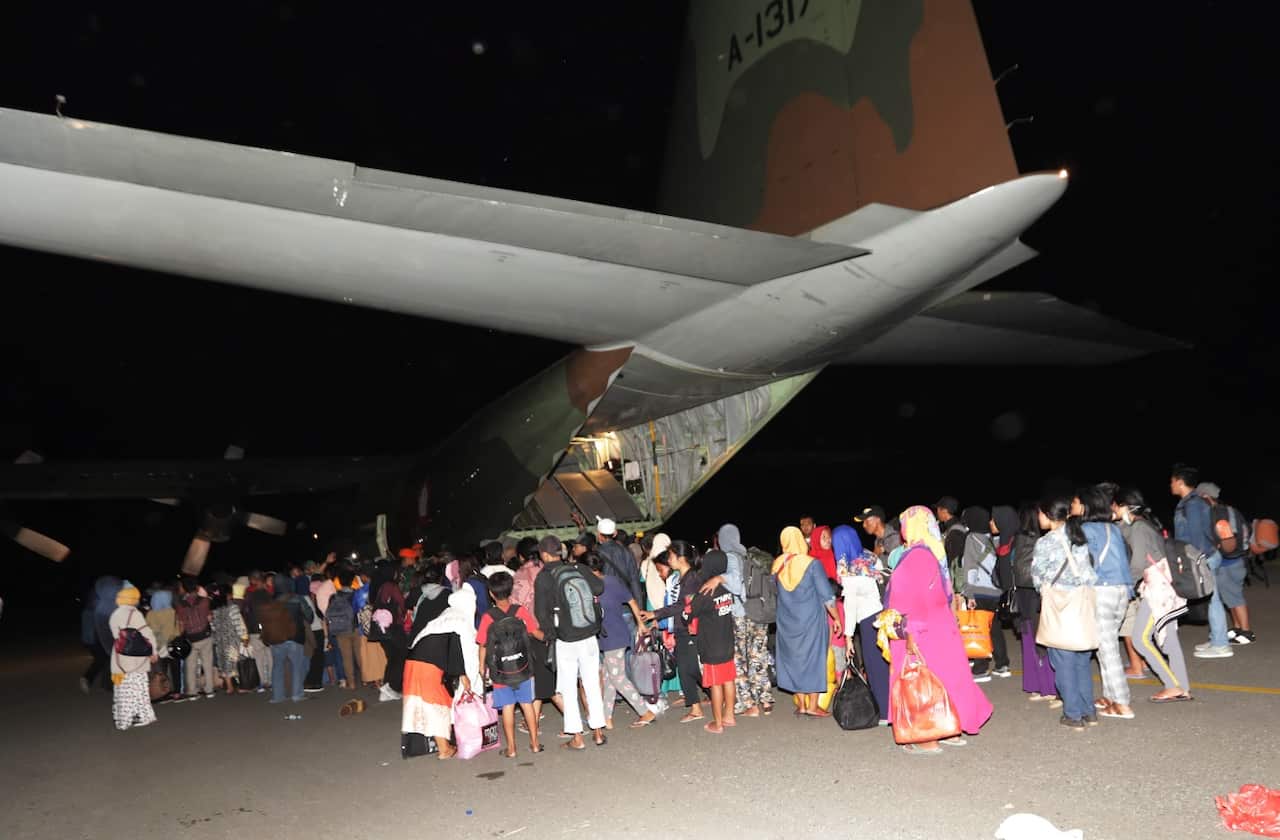 Palu residents queue to depart on a military plane at Mutiara Sis Al Jufri Airport in Palu, Central Sulawesi, Indonesia, 01 October 2018.