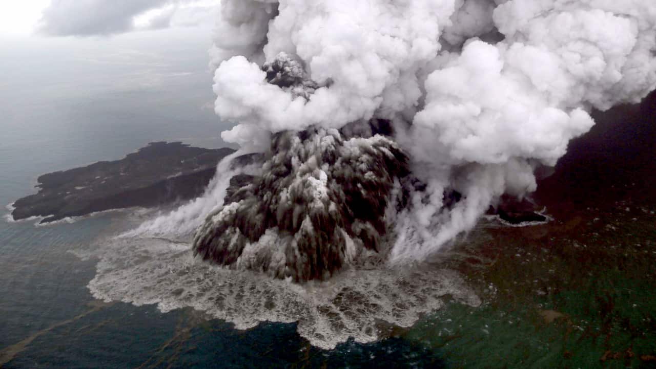 An aerial view shows mount Anak Krakatau erupting in Lampung, Indonesia, 23 December.