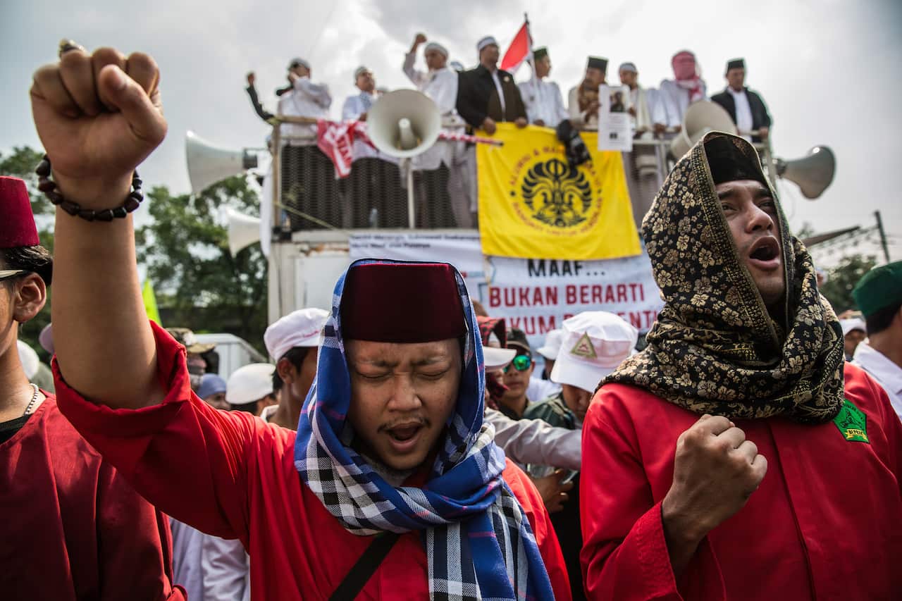 Islamic hard-liners calling for the jailing of the author of a poem they considered insulting to Islam, during a demonstration in Jakarta, Indonesia.