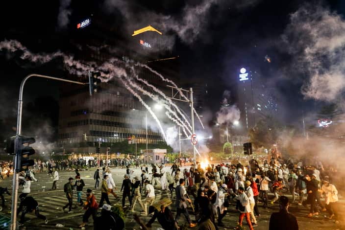 Indonesian protesters clash with the police during a protest outside of the Election Supervisory Board (Bawaslu) building in Jakarta.