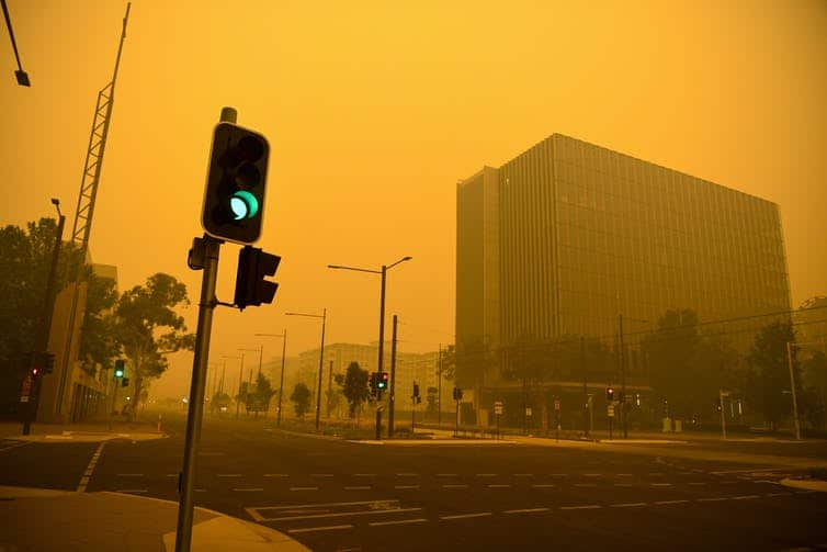 A smoke-filled Canberra street earlier this year as bushfires burn nearby. 