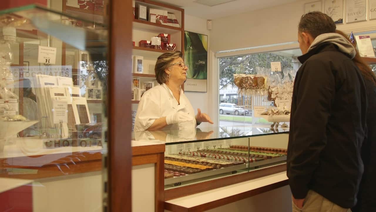 Isilda serving customers in the Mornington Peninsula Chocolate shop.