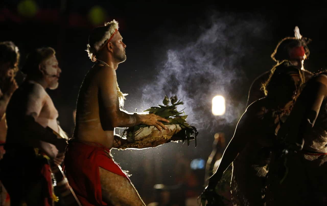 Indigenous dancer perform a smoking ceremony during the Saturday night vigil. 