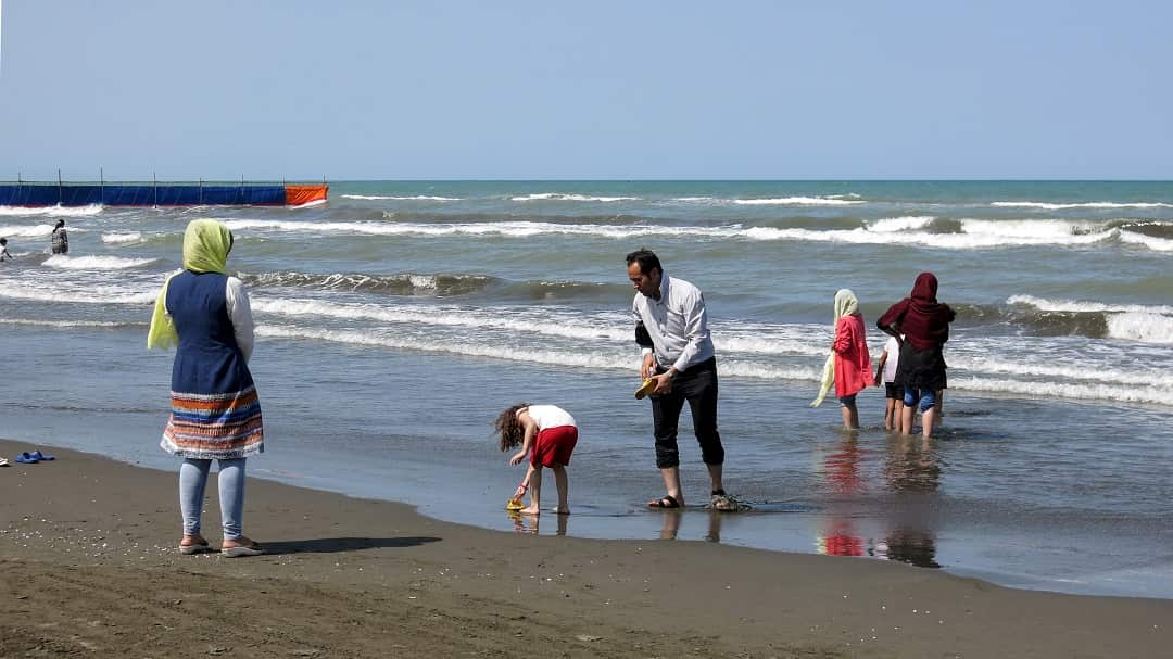 An Iranian family at the beach in the Caspian Sea port city of Gisum. 