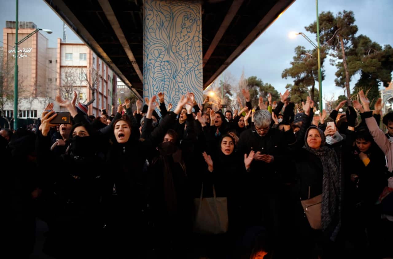Iranians protest to show their sympathy to victims of Ukraine International Airlines Boeing 737-800 in front of the Amir Kabir University in Tehran