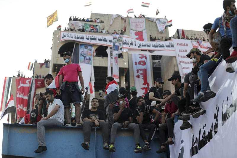 Ann-government protesters gather in a building near Tahrir Square.