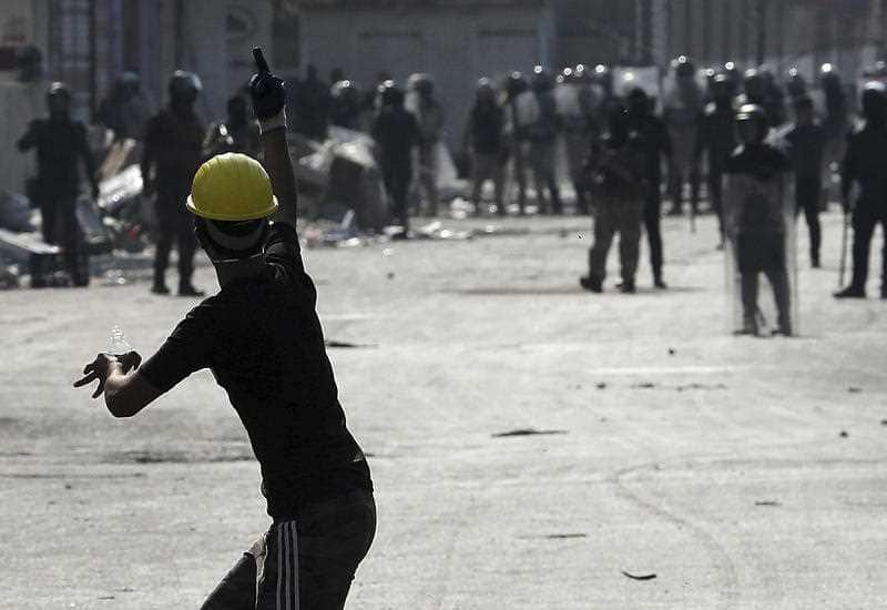 Iraqi security forces try to disperse anti-government protesters during ongoing protests in Baghdad.