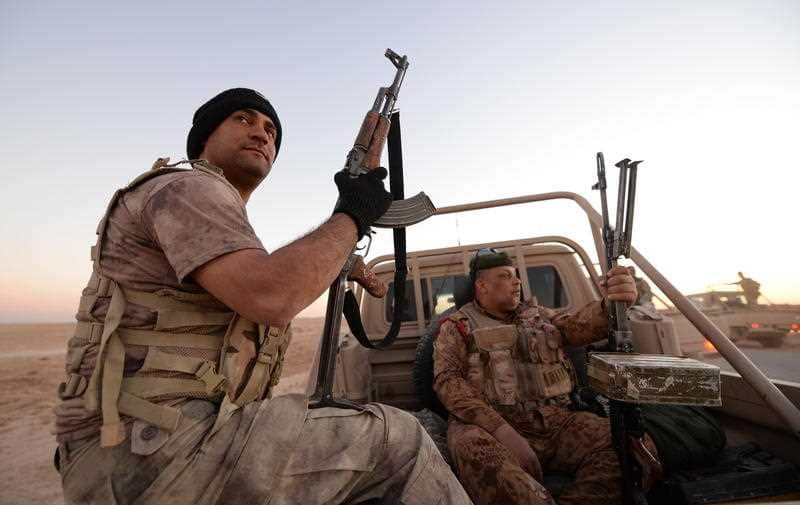 Iraqi border guards patrol an area near the al-Qaim Abu Kamal border crossing, which borders on territory in IS hands.